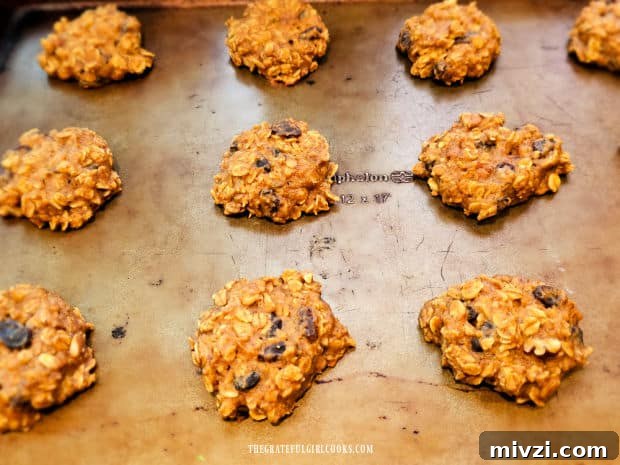 After baking, the cookies cool slightly on the baking sheet.