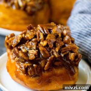 Sticky buns topped with caramel and pecans.