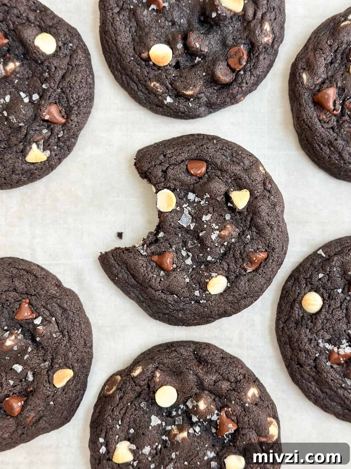 Inside-Out Chocolate Chip Cookies Recipe — Gooey Center Cookies 2 a bite missing from an inside out chocolate chip cookie.
