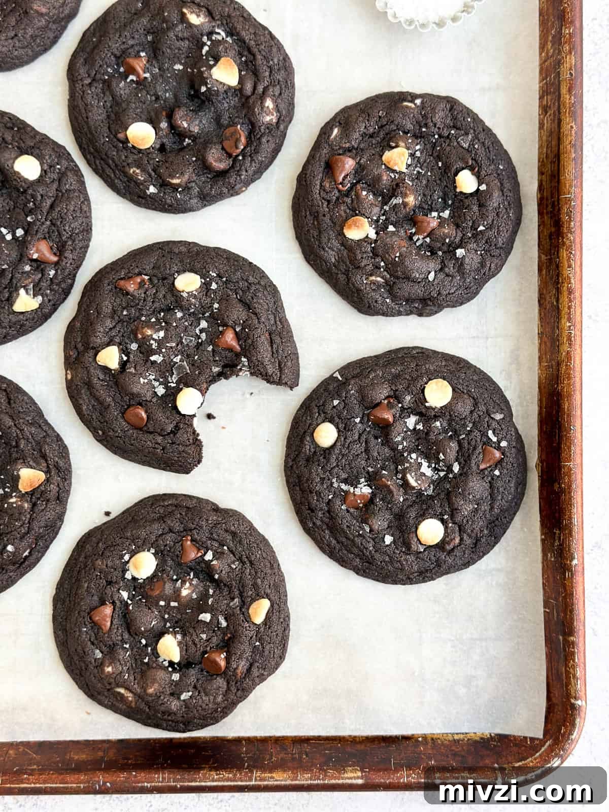 Inside-Out Chocolate Chip Cookies Recipe — Gooey Center Cookies 8 a bunch of inside out chocolate chip cookies on a baking sheet.