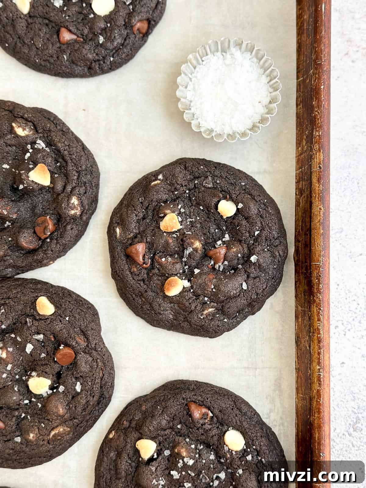 Inside-Out Chocolate Chip Cookies Recipe — Gooey Center Cookies 9 a close up of cookies with salt.