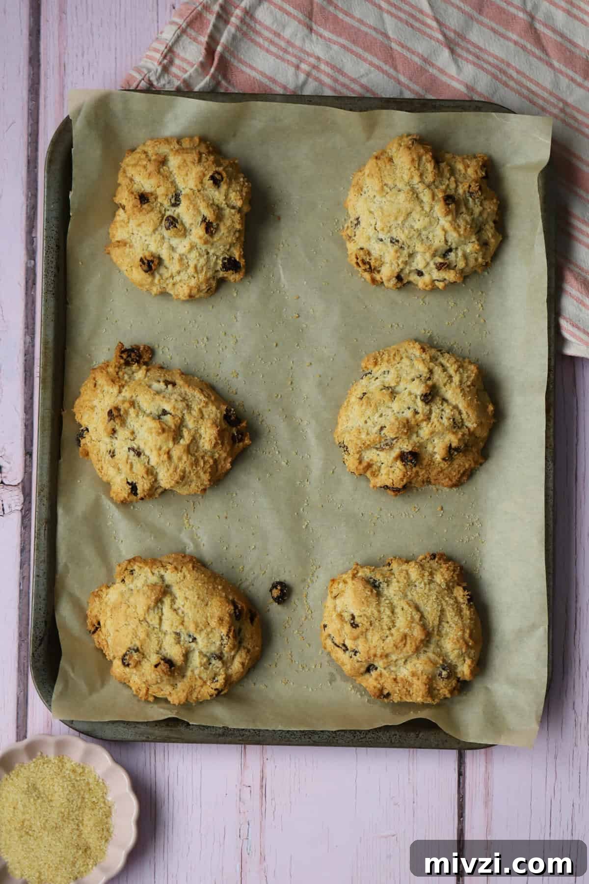 A baking tray with 6 gluten free rock cakes on.