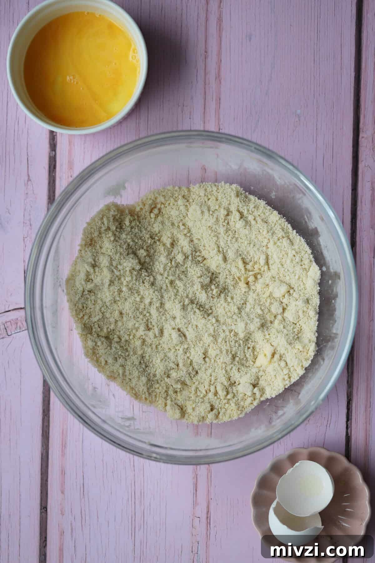 Rub together the butter and dry ingredients until it looks like breadcrumbs.