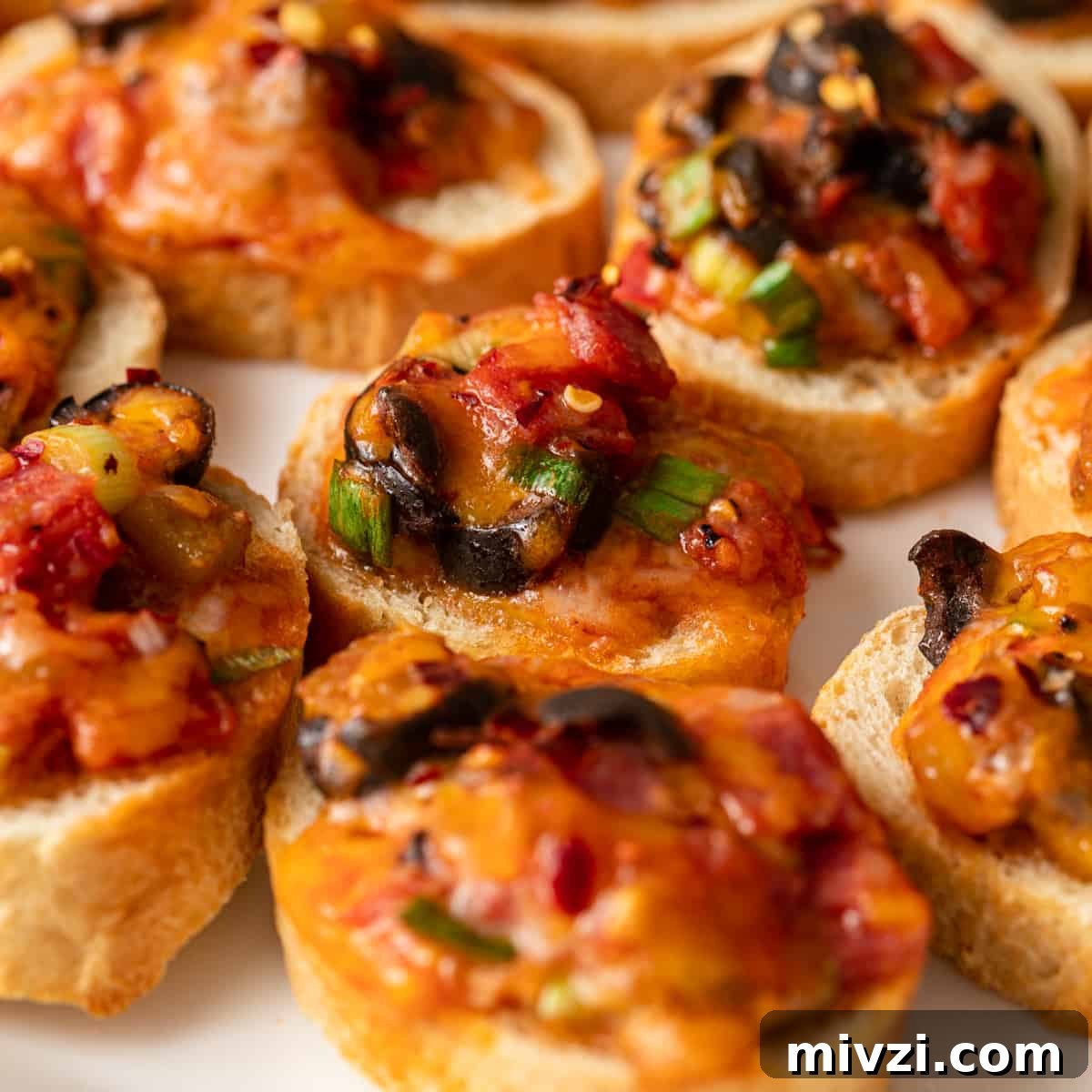 Mini Pizza Bites: Quick Party Appetizers for Any Occasion 2 mini pizza bites on a platter