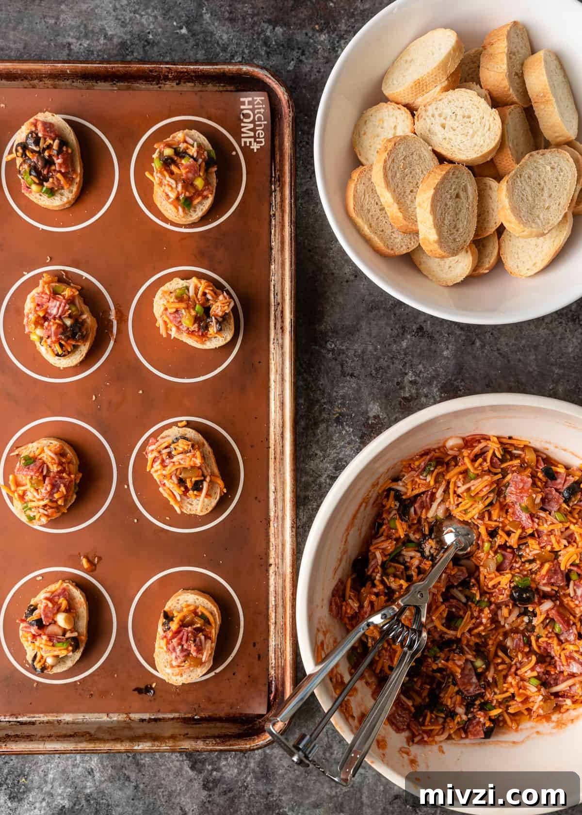 Mini Pizza Bites: Quick Party Appetizers for Any Occasion 5 adding toppings to bread