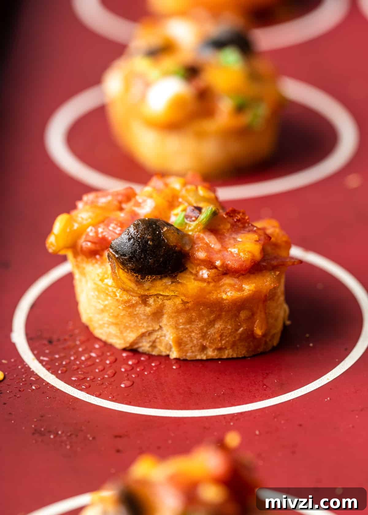 Mini Pizza Bites: Quick Party Appetizers for Any Occasion 6 side view of mini pizza bites