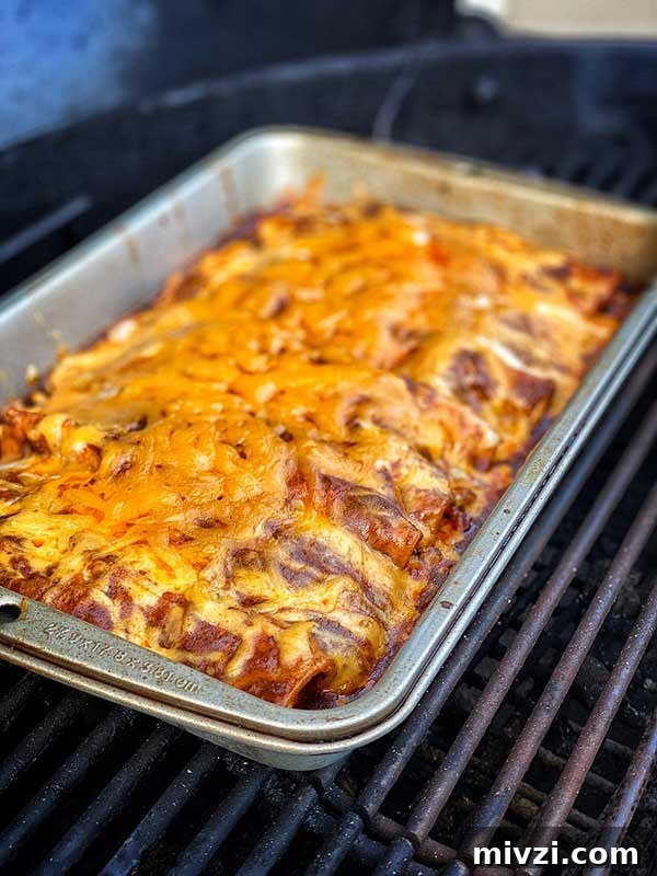 A pan of smoked chicken and cheese enchiladas