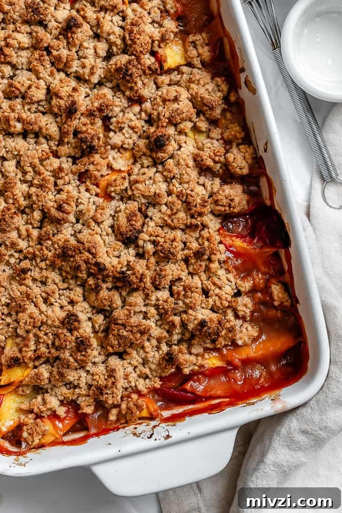 completed Easy Vegan Peach Cobbler in baking dish