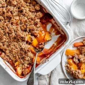 completed Easy Vegan Peach Cobbler in baking dish