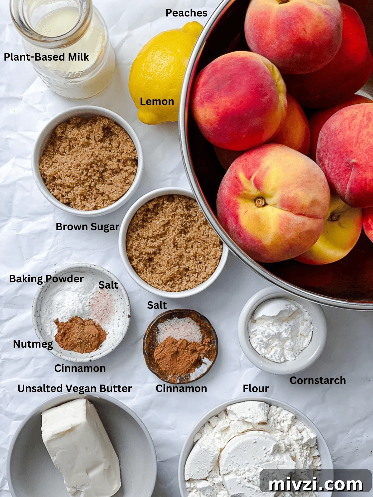 ingredients for Easy Vegan Peach Cobbler on a white surface