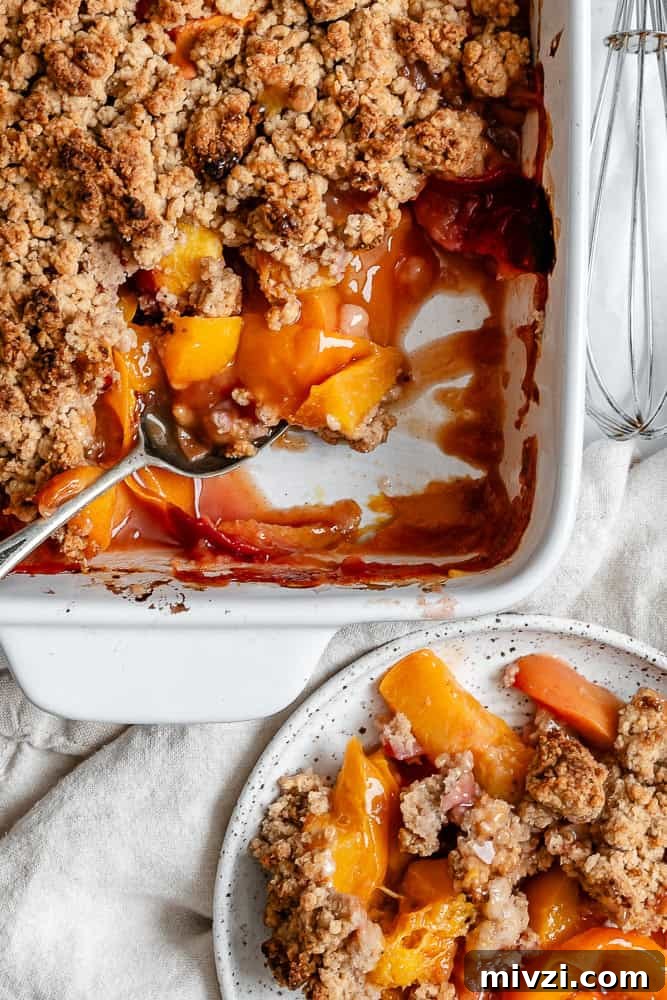 completed Easy Vegan Peach Cobbler in baking dish