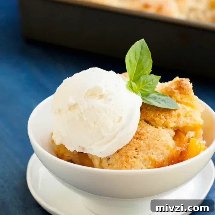 Georgia Peach Cobbler. Fresh peaches, lightly spiced and sweetened with two kinds of sugar are baked under a delicious sweet biscuit topping!