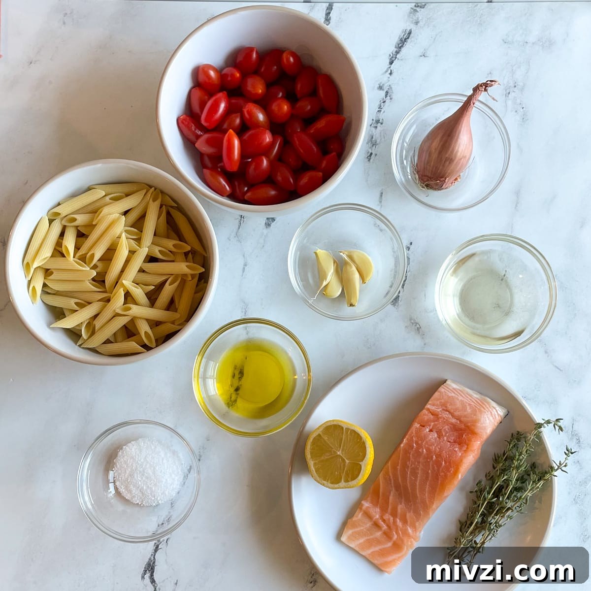 The ingredients for Penne al Salmone are shown on a white marble counter.