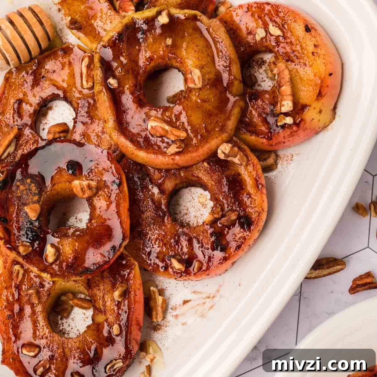 Caramelized Grilled Apples with Cinnamon and Honey 11 Slice Grilled Apples on a white plate