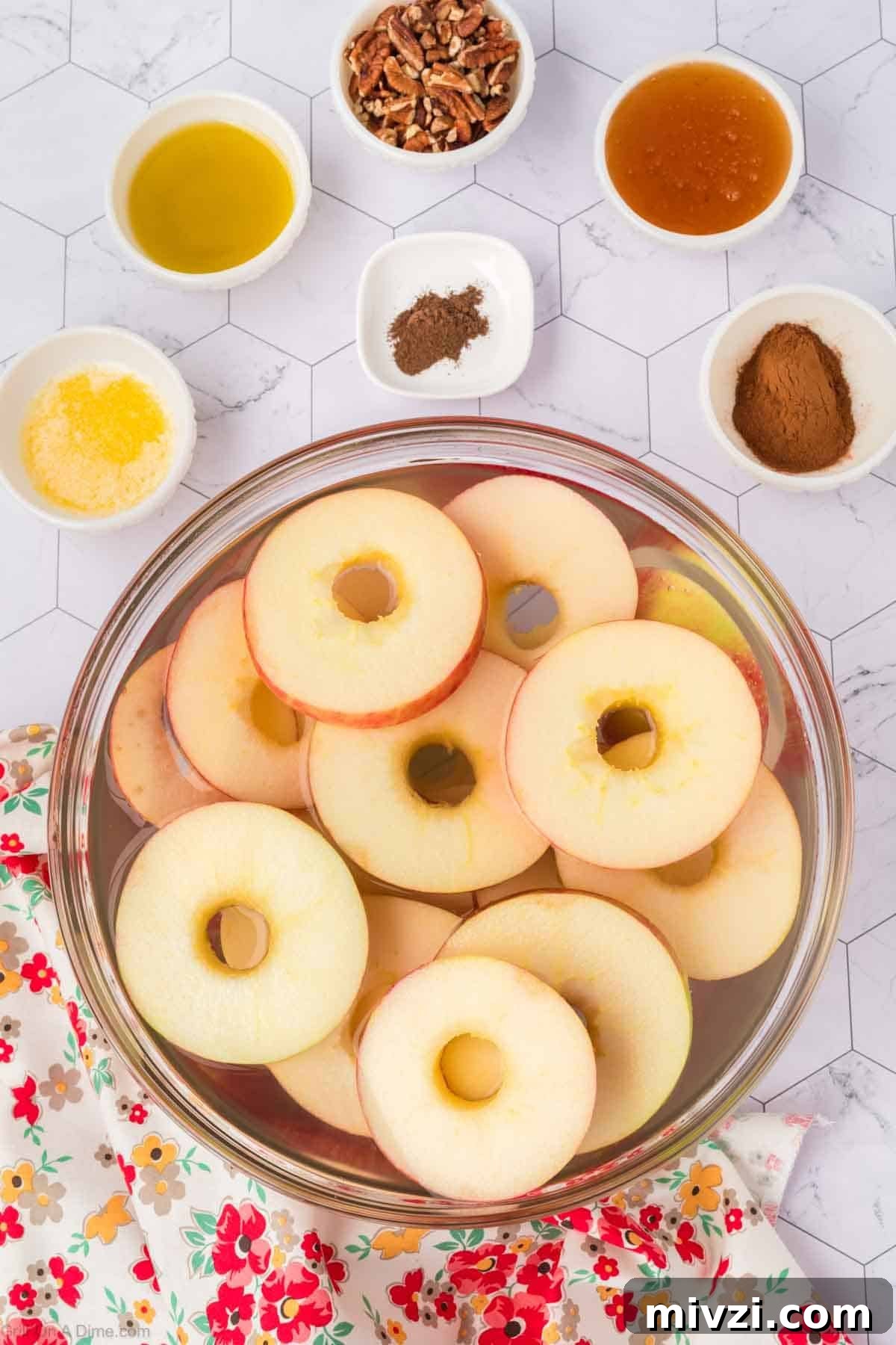 Caramelized Grilled Apples with Cinnamon and Honey 5 Slice apples in a bowl with small bowls of spices, oil, honey, and chopped pecans