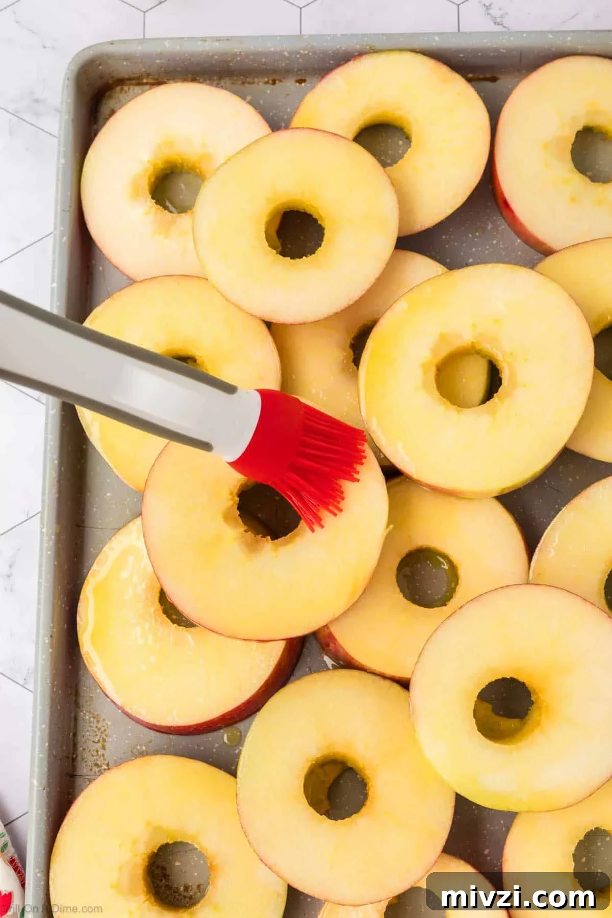 Caramelized Grilled Apples with Cinnamon and Honey 8 Brushing the oil onto the apple slices on the baking sheet