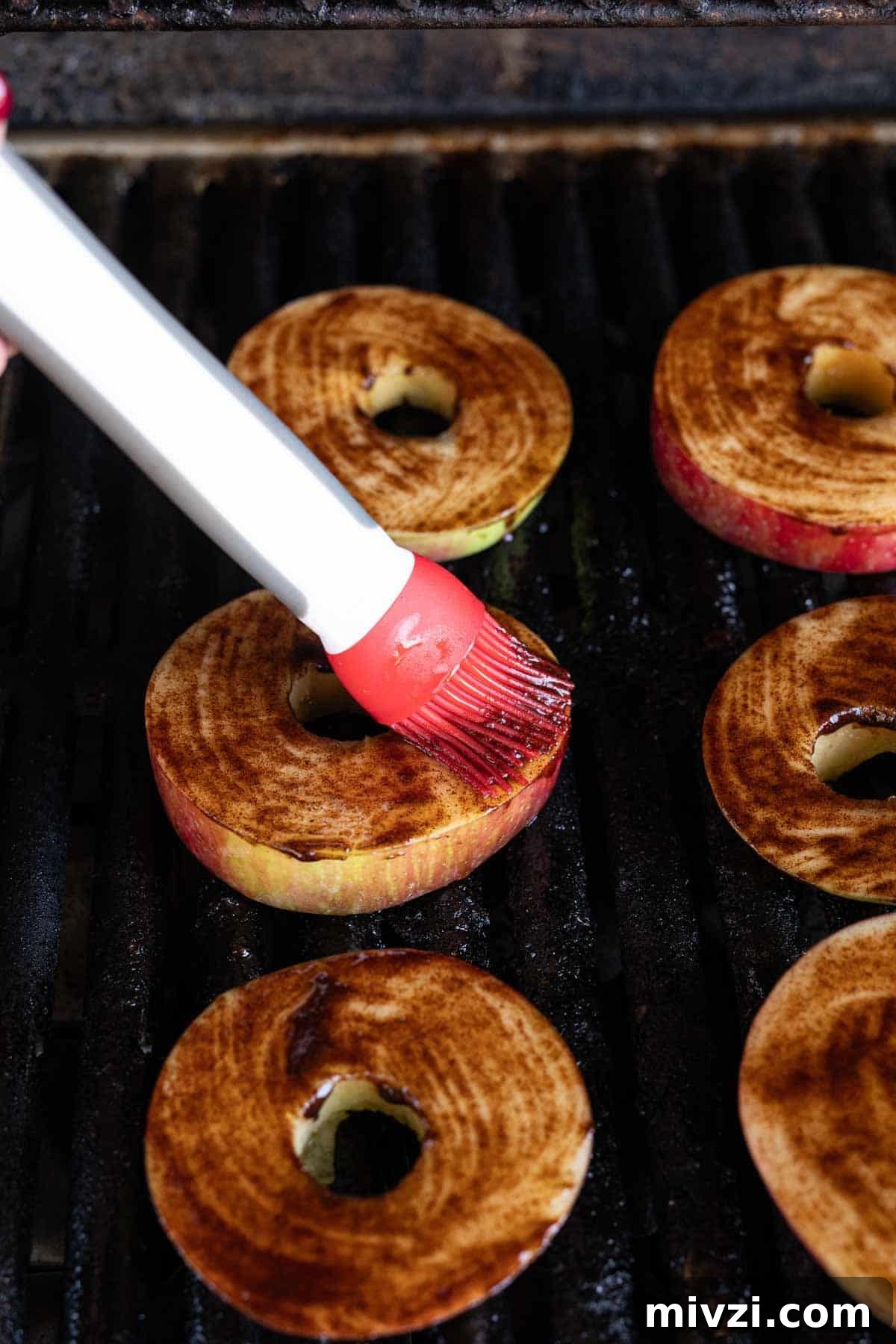 Caramelized Grilled Apples with Cinnamon and Honey 9 Brushing the cinnamon mixture onto the apple slices on the grill grates