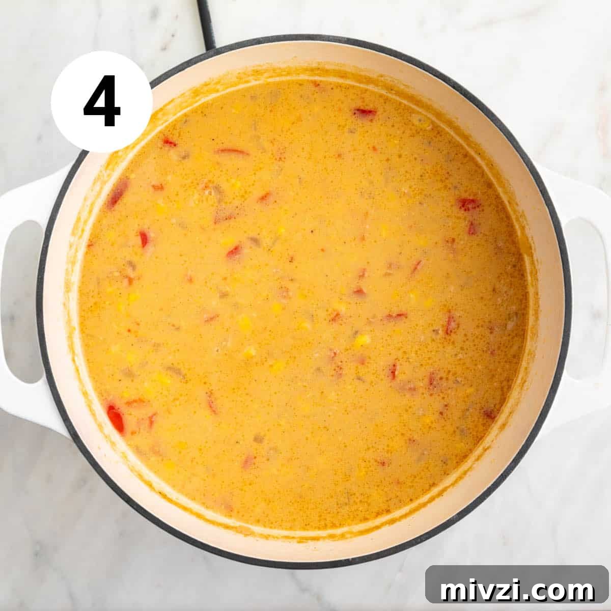 Blended vegan potato and corn chowder in a large pot.