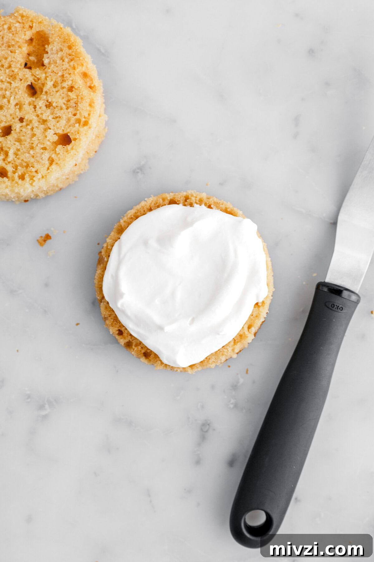 whipped cream on slice of cake.