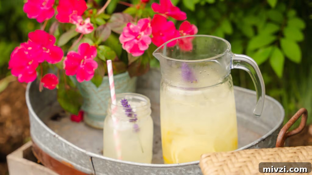Homemade lemonade recipe outside on track with flowers