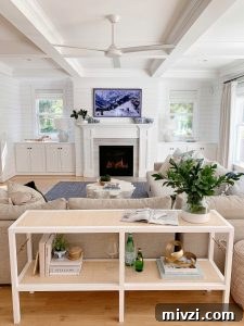 Samsung Frame tv in living room over fireplace