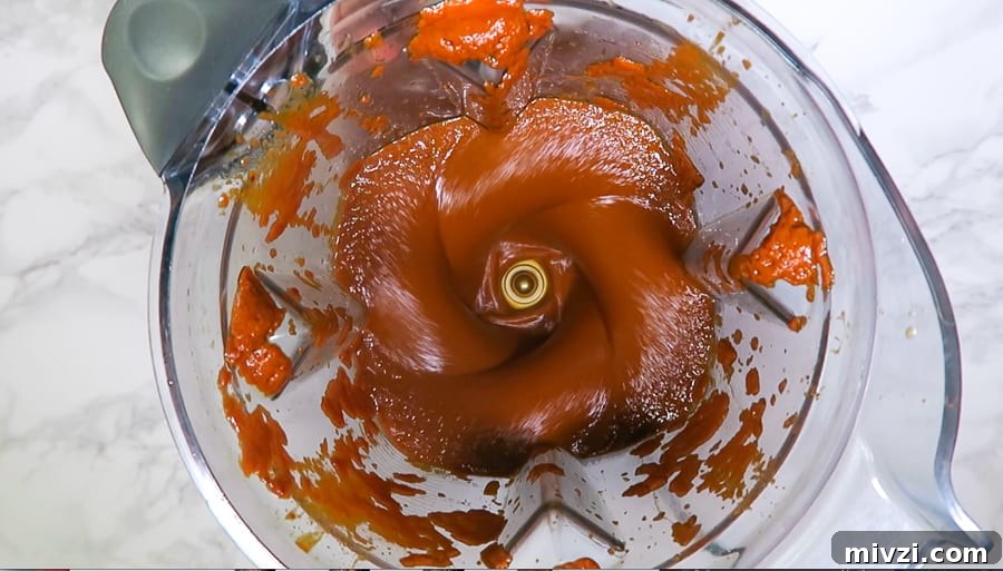 red chile sauce being blended in a vitamix