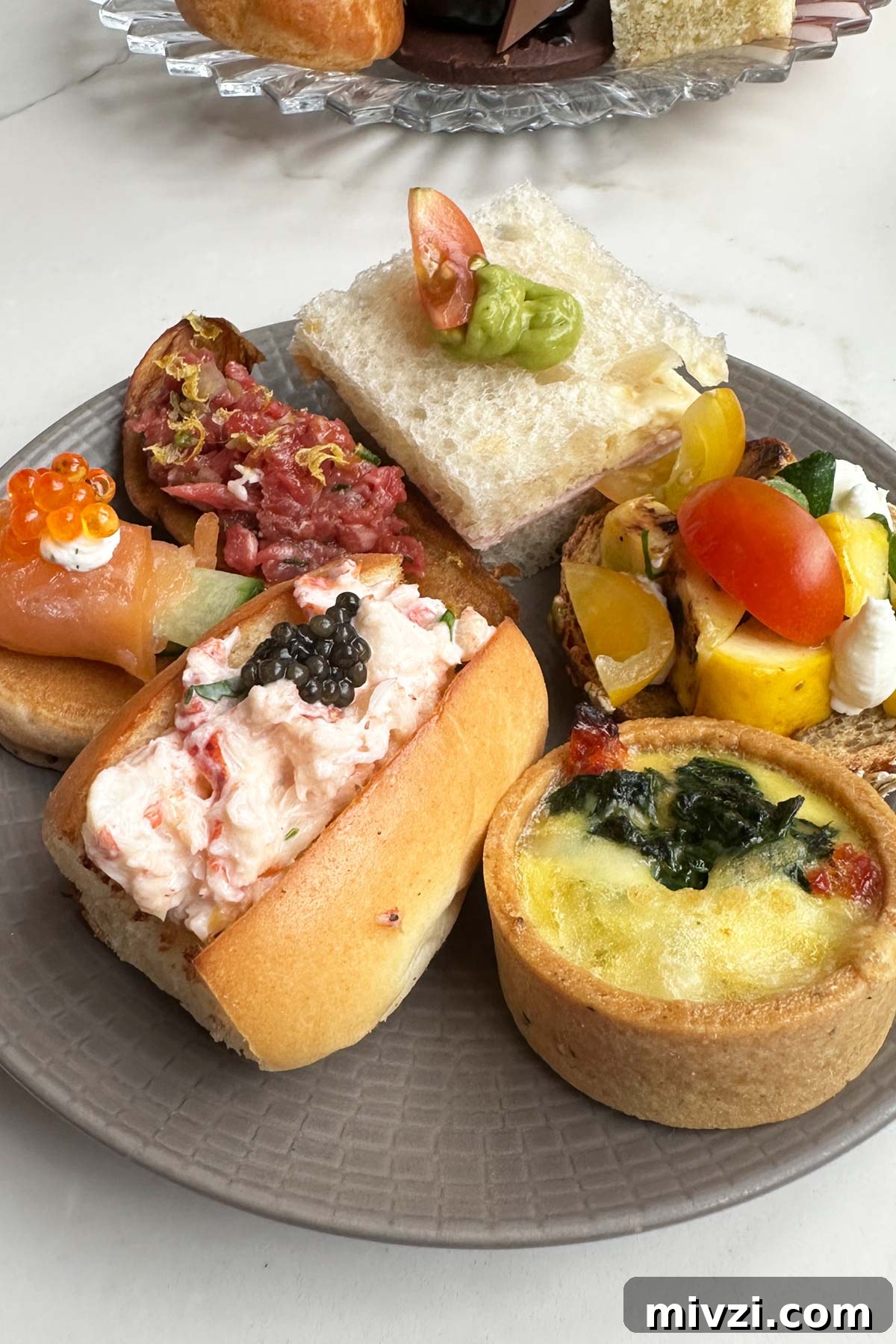 Afternoon Tea at Baccarat Hotel New York: A Luxurious Review 6 Baccarat savories on a plate.