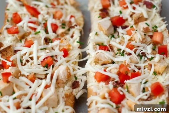 Garlic Bread Pizza with Chicken and Crispy Bacon 5 Delicious Garlic Bread Pizza with mozzarella, tomatoes and chicken.