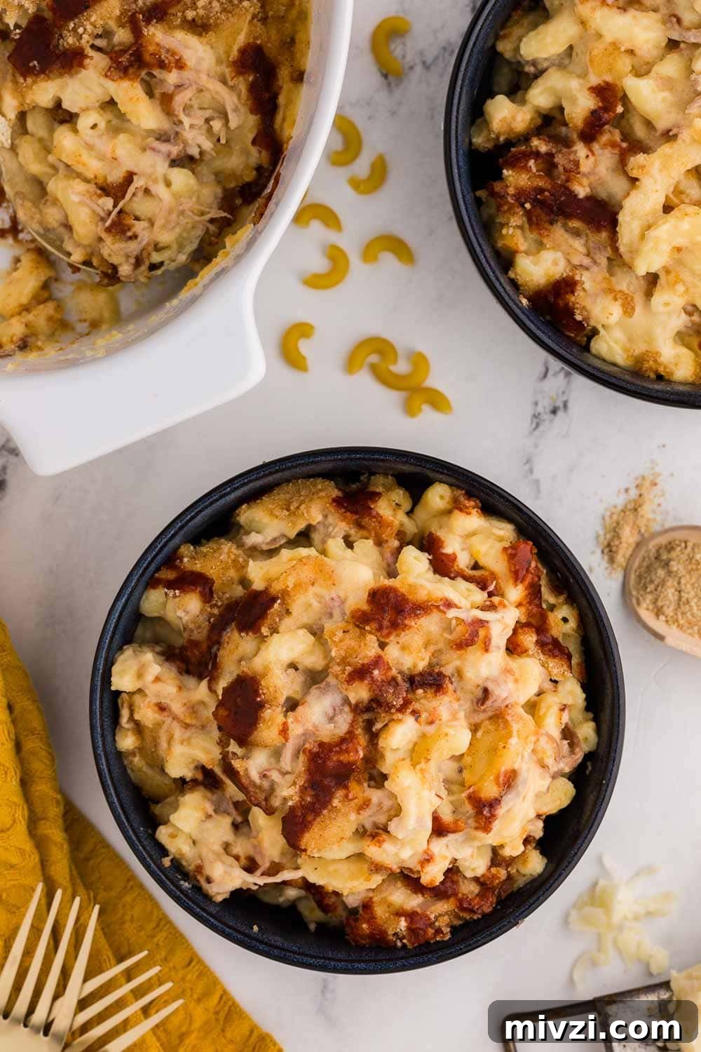 Pulled Pork Mac and Cheese Recipe — Slow-Cooked BBQ Comfort Dish 6 bowls of pulled pork Mac and cheese next to white serving dish