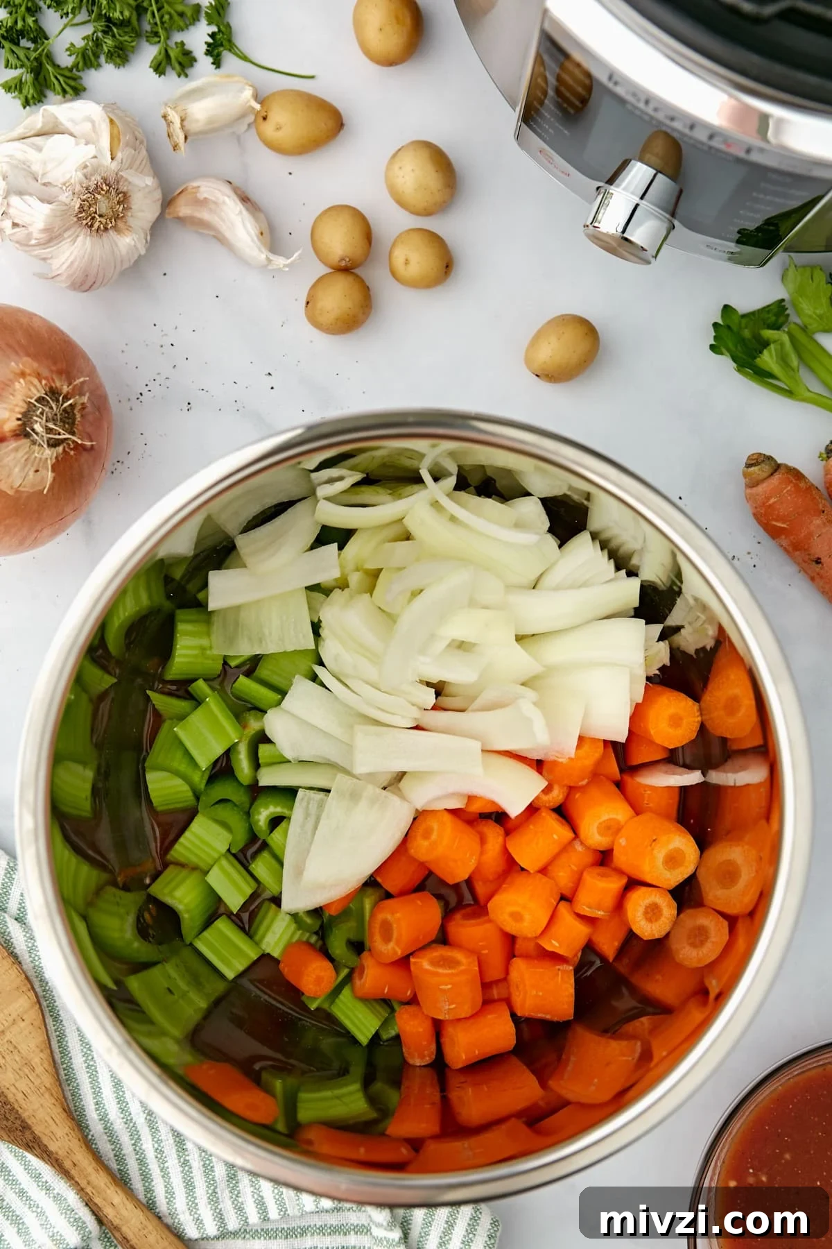 An Instant Pot filled with vegetables.