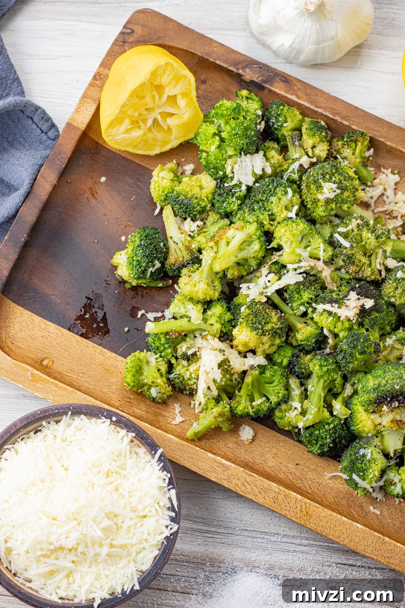 broccoli that has been roasted and topped with parmesan cheese