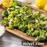 roasted broccoli on a wooden platter