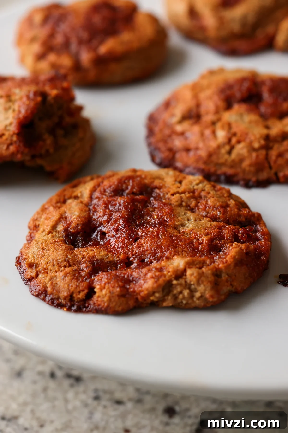 Gochujang Caramel Cookies — Gluten-Free with Nut-Free Options 90 close-up of gochujang caramel cookies on the baking sheet