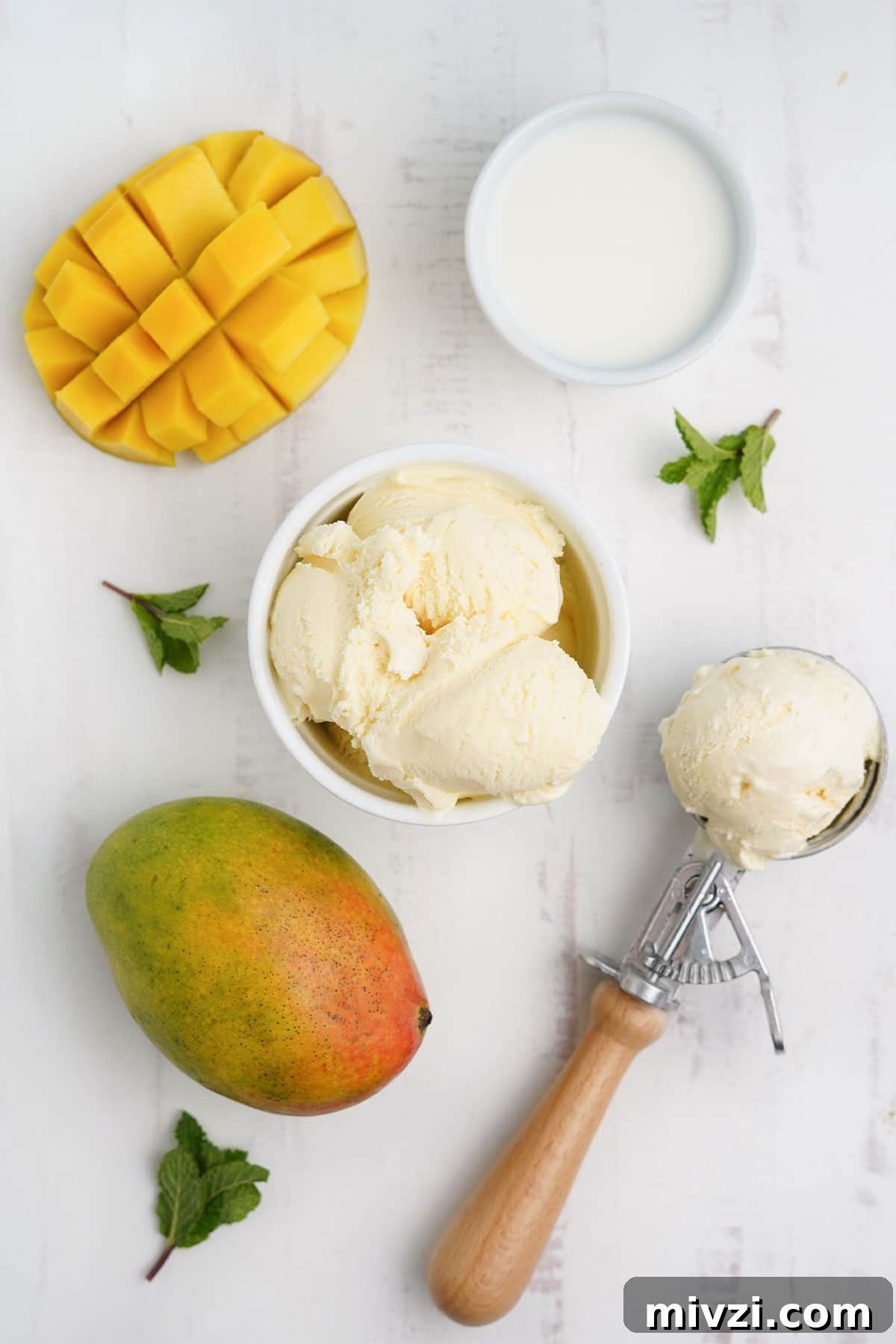 Ingredients to make a mango milkshake on the table.