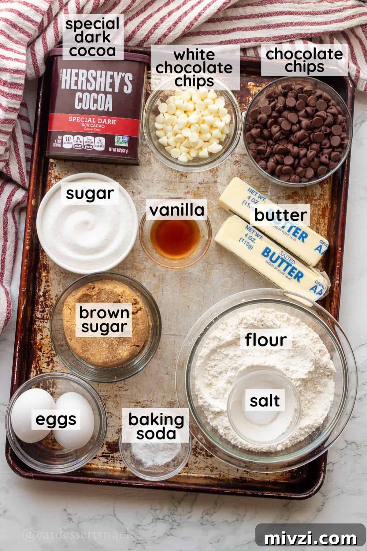 Spider Web Halloween Cookies: Step-by-Step Recipe & Decorating Tips 3 Labeled ingredients for halloween spider web cookies in glass bowls on metal baking tray.