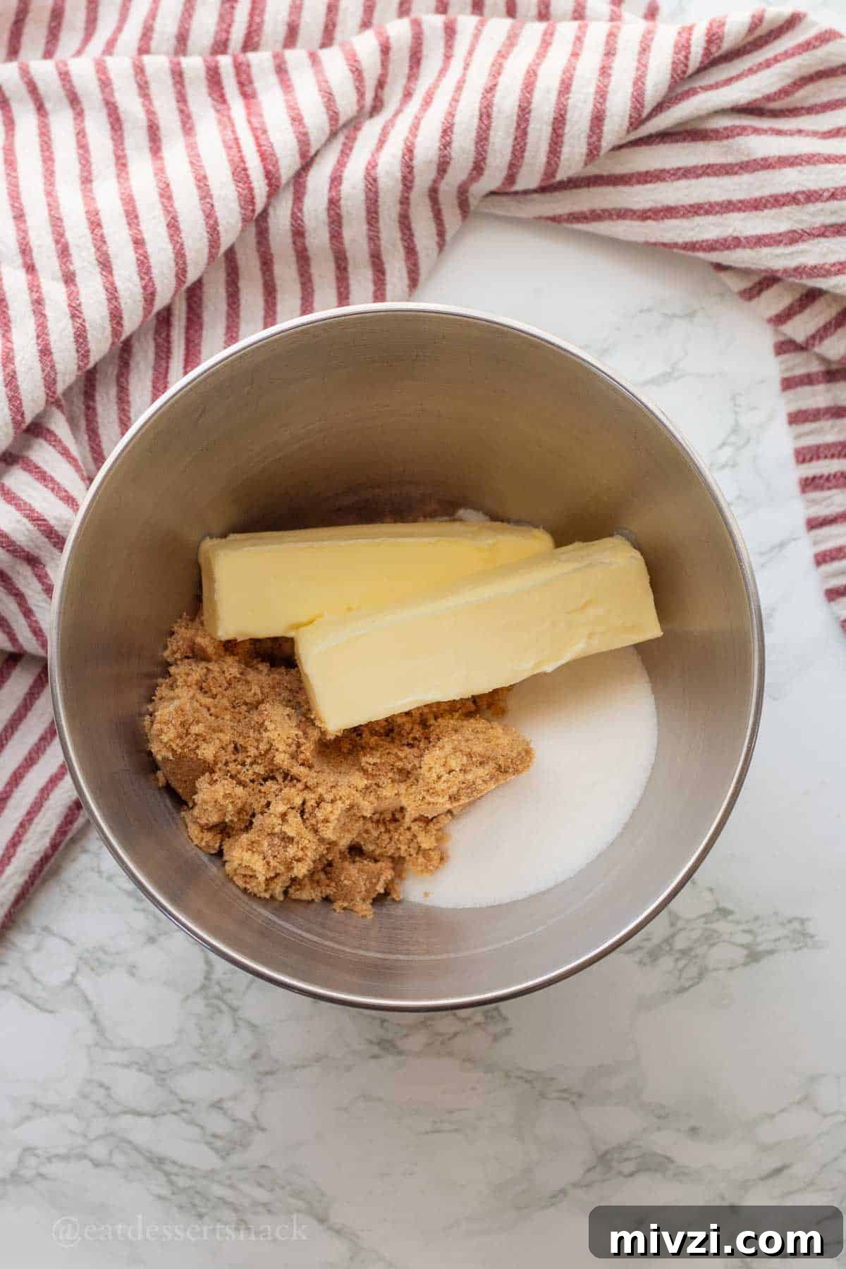 Spider Web Halloween Cookies: Step-by-Step Recipe & Decorating Tips 4 Butter, brown sugar, white sugar in metal mixing bowl.