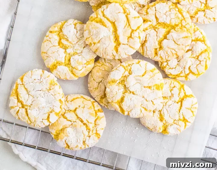 Tangy Lemon Cake Mix Cookies Recipe: Quick Zesty Cookies 2 overhead photo of lemon crinkle cookies on a wire rack