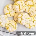 Tangy Lemon Cake Mix Cookies Recipe: Quick Zesty Cookies 5 overhead photo of lemon crinkle cookies on a wire rack