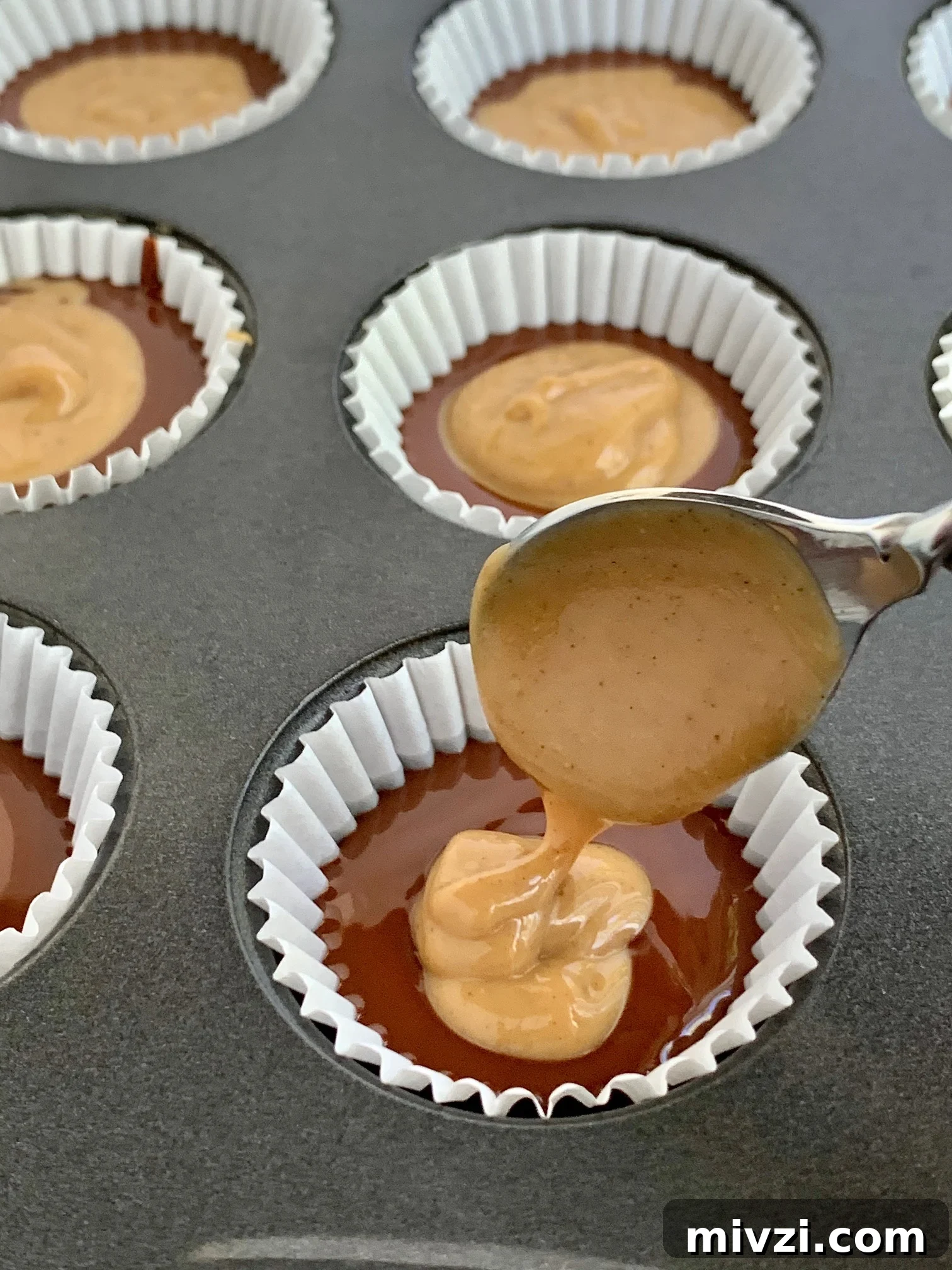 Place a peanut butter mixture on top of the melted chocolate mixture