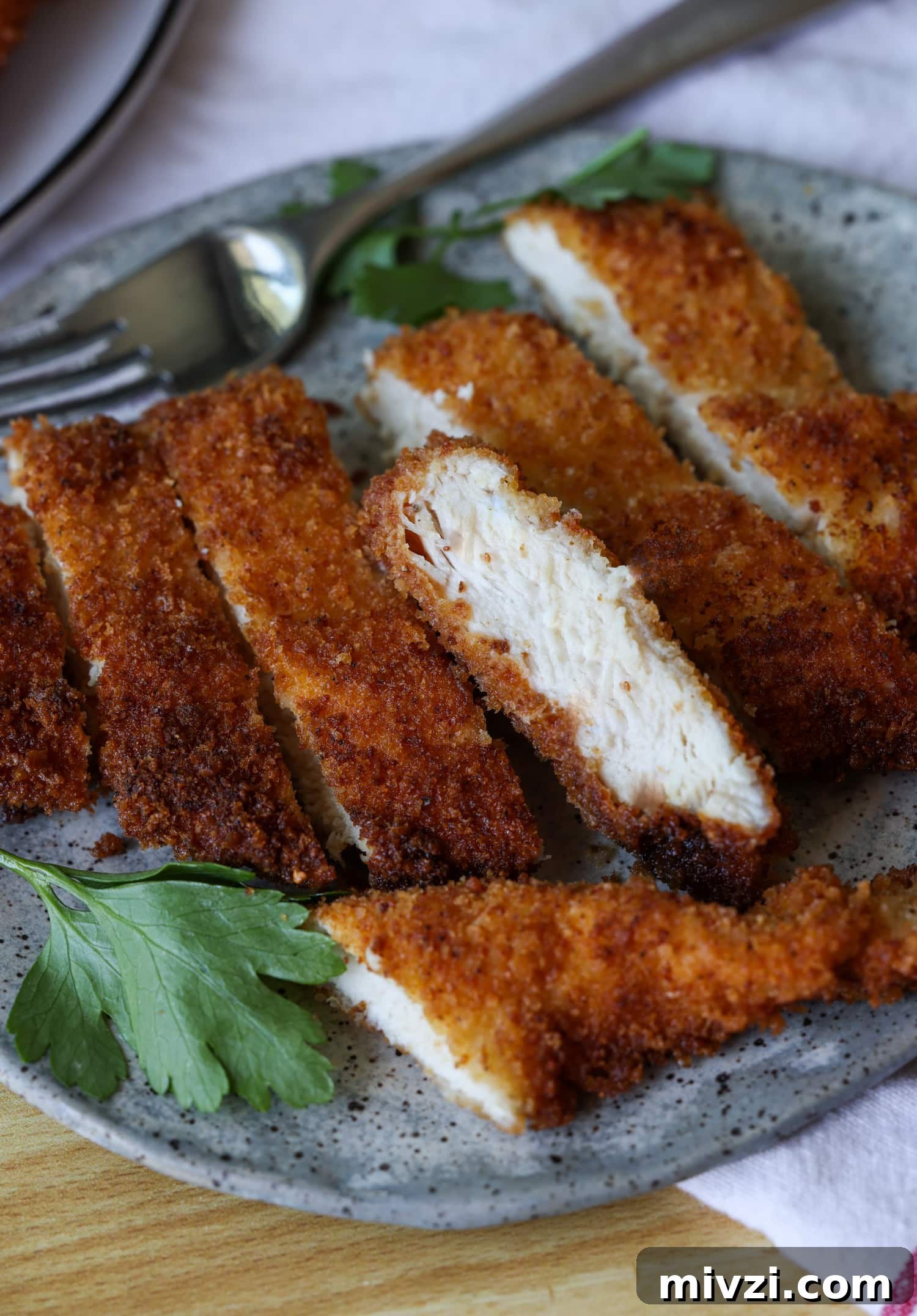 Sliced chicken cutlets sliced chicken cutlets on a plate