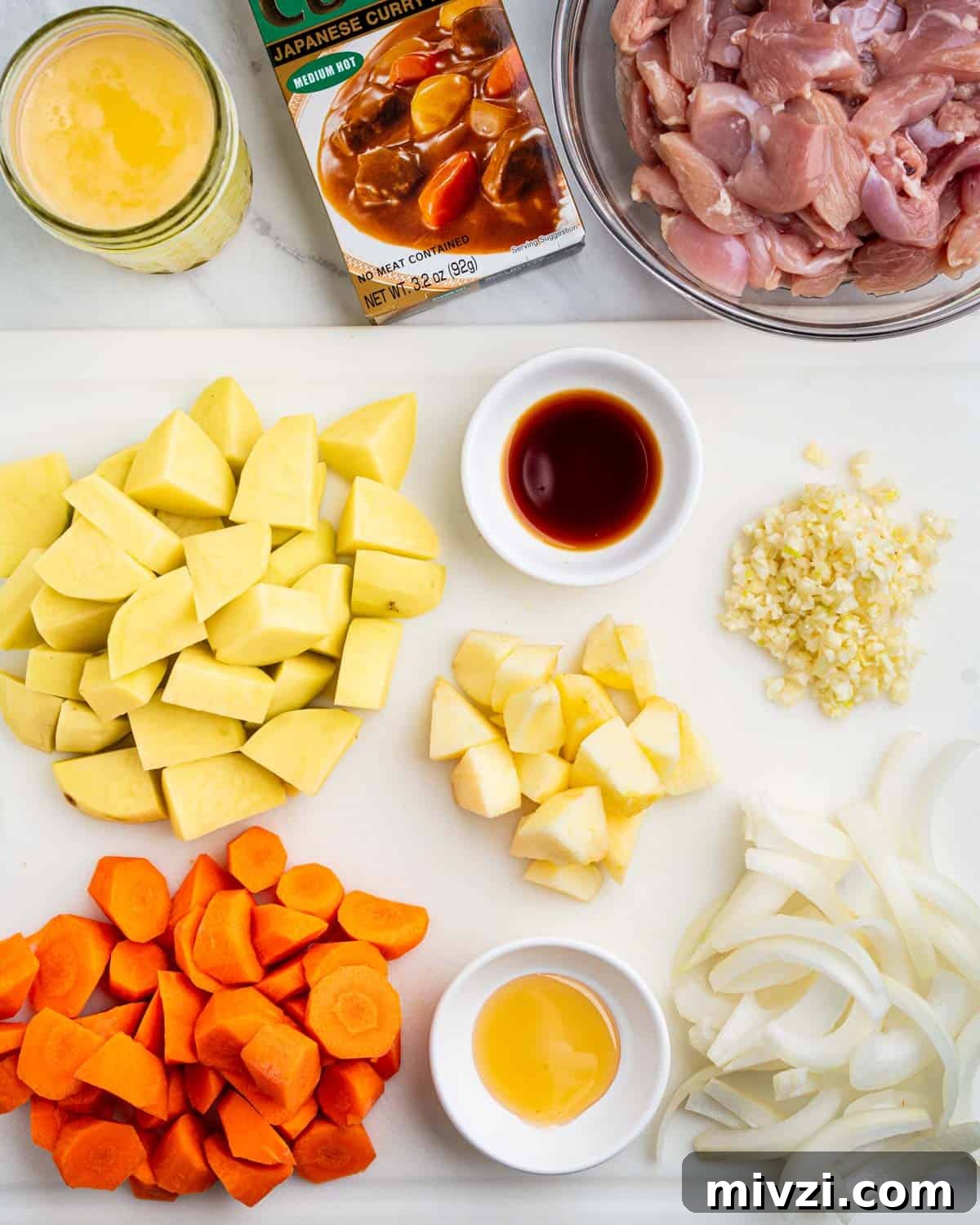 Authentic Japanese Chicken Curry Recipe for Rich, Comforting Flavor 4 ingredients needed for Japanese chicken curry, chopped vegetables, curry roux package.