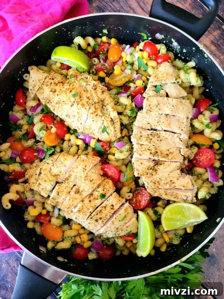 Summer Tomato and Corn Pasta Salad Recipe 2 Tomato Corn Pasta Salad with basil pesto chicken, sweet corn, jalapeños & lime, this easy chicken salad recipe is tangy, creamy, spicy! Serve it up hot or serve it chilled, this is one 30-minute summer pasta salad perfect for BBQs & meal prep.