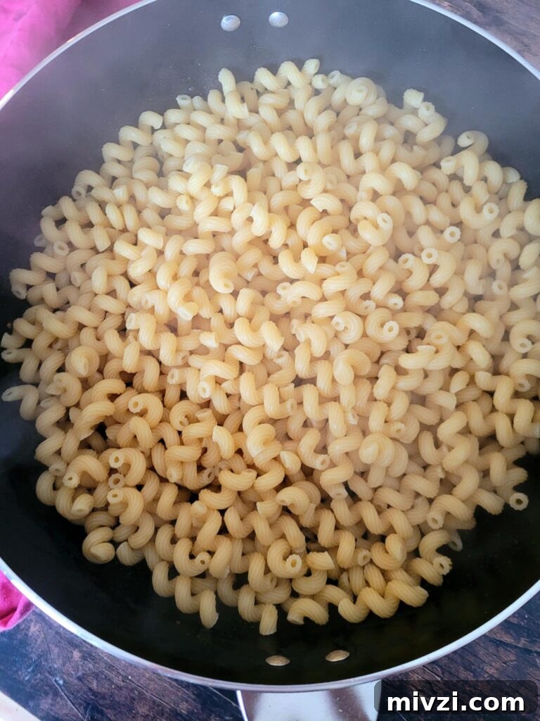 Summer Tomato and Corn Pasta Salad Recipe 4 cooked curly pasta in a strainer