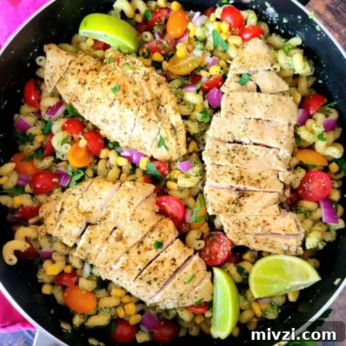 Summer Tomato and Corn Pasta Salad Recipe 10 Tomato Corn Pasta Salad with basil pesto chicken, sweet corn, jalapeños & lime, this easy chicken salad recipe is tangy, creamy, spicy! Serve it up hot or serve it chilled, this is one 30-minute summer pasta salad perfect for BBQs & meal prep.
