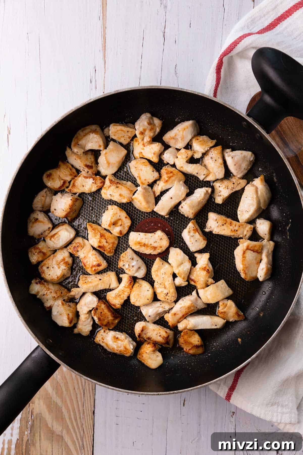 Brazilian-Style Chicken Stroganoff Recipe for Dinner 5 a skillet of cooked chicken