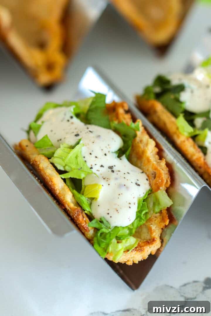 Cold and Room-Temperature Appetizers: 30 Make-Ahead Ideas 11 Caesar salad tacos with parmesan shell placed in taco holder