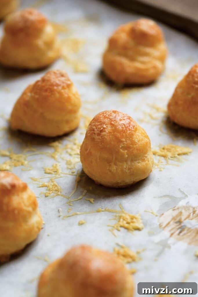 Cold and Room-Temperature Appetizers: 30 Make-Ahead Ideas 12 three ingredient gougeres on a baking sheet