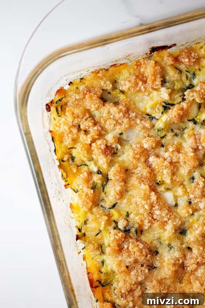 overhead view of keto zucchini casserole in glass casserole dish ready to be served