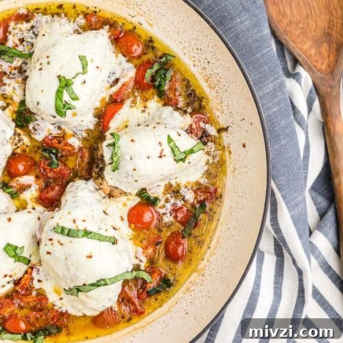 overhead view of keto chicken thighs covered with mozzarella cheese