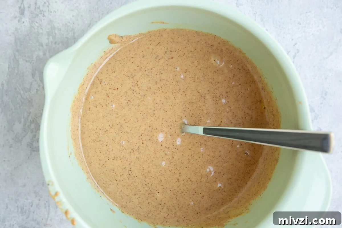 Mixing bowl full of wet ingredients.